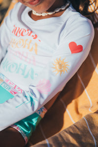Aloha Crop Long Sleeve Rash Guard Top in White